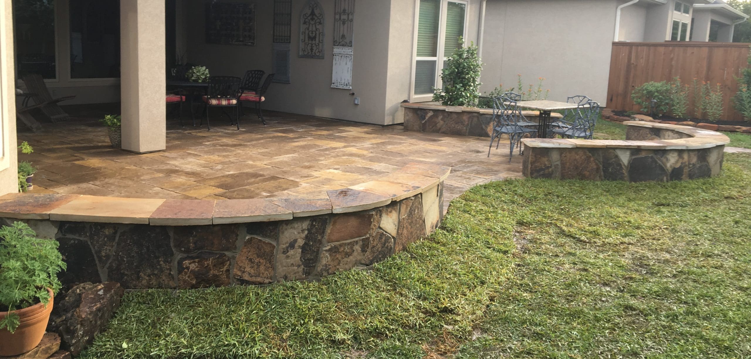 Paver patio with sitting wall built by Theiss Landscape Works